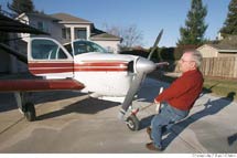 (Photo - Burl Skaggs with his airplane)