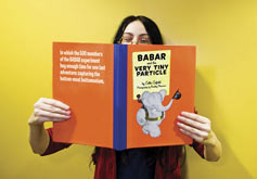(Photo - woman with BaBar storybook)