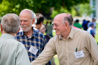 (Photo - 
			Jonathan Dorfan greets well-wishers at the ice cream and cake social on the SLAC green.)