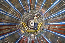 (Photo - man working on the ATLAS detector)